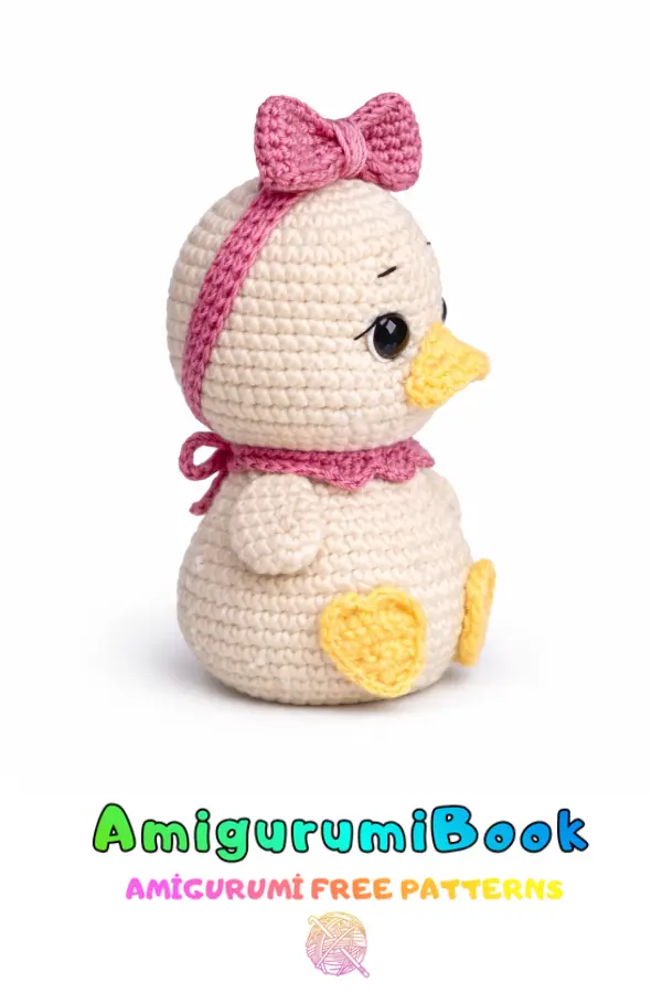 cute duckling amigurumi crochet doll with pink bow