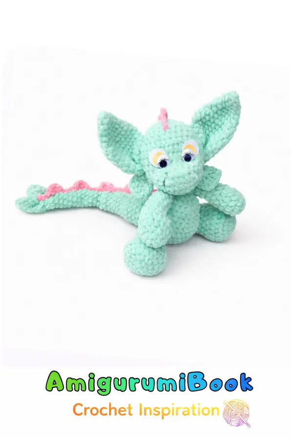 Green plush dragon amigurumi crochet toy with big ears and soft texture, handmade with plush yarn