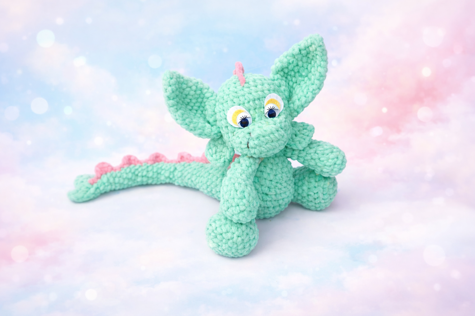 Cute plush dragon amigurumi crochet toy made with soft yarn, handmade fantasy amigurumi